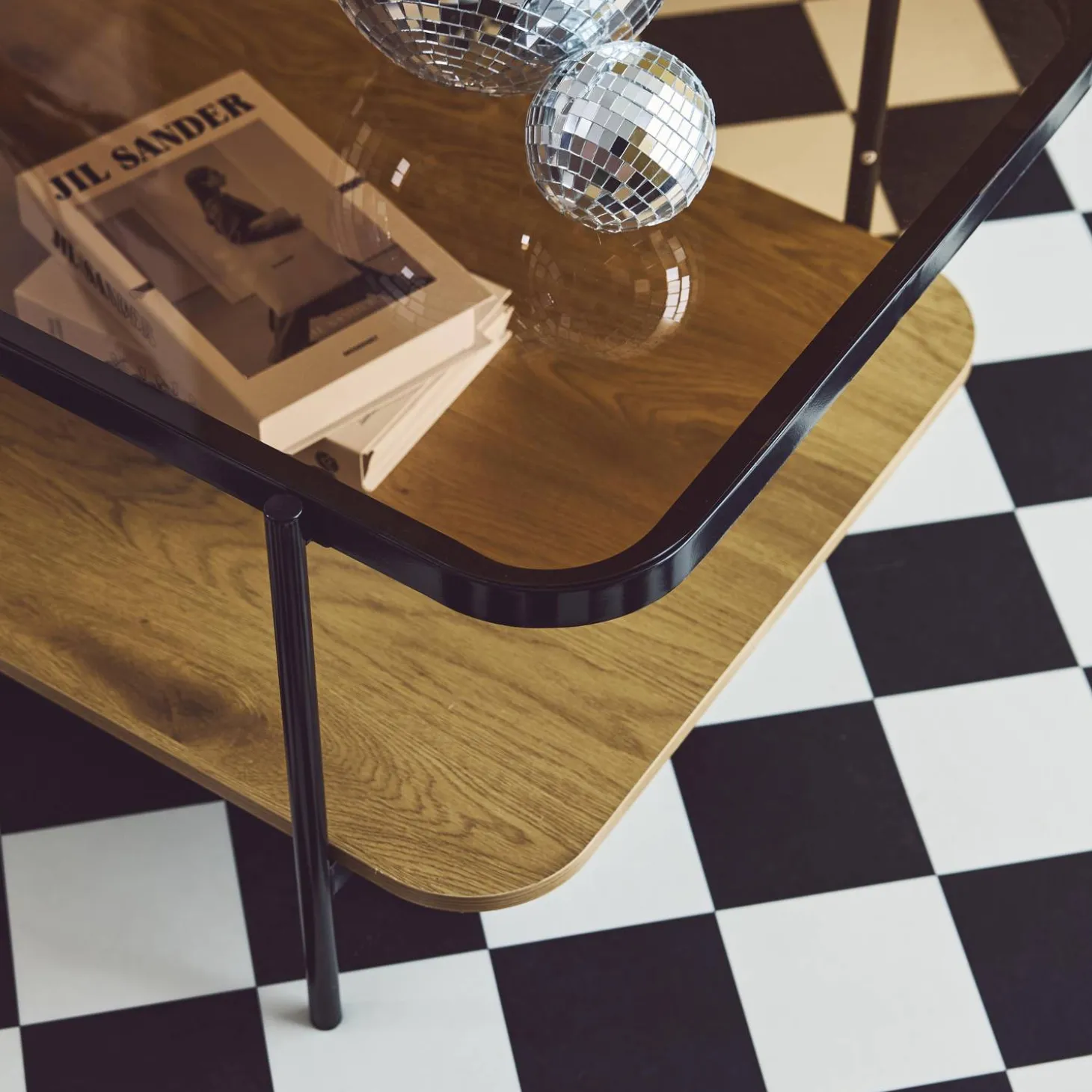 Vintage Couchtisch aus schwarzem Metall mit Glasplatte und Holzdekor