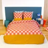 Bettwäsche-Set aus Baumwolle mit Schachbrettmuster für zwei Personen rot und orange