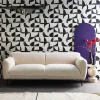 3-Sitzer-Sofa mit cremefarbenem Bouclé-Bezug und Metallbeinen